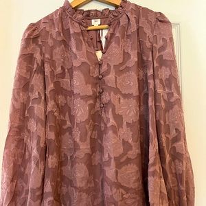 Blouse with appliqué flowers